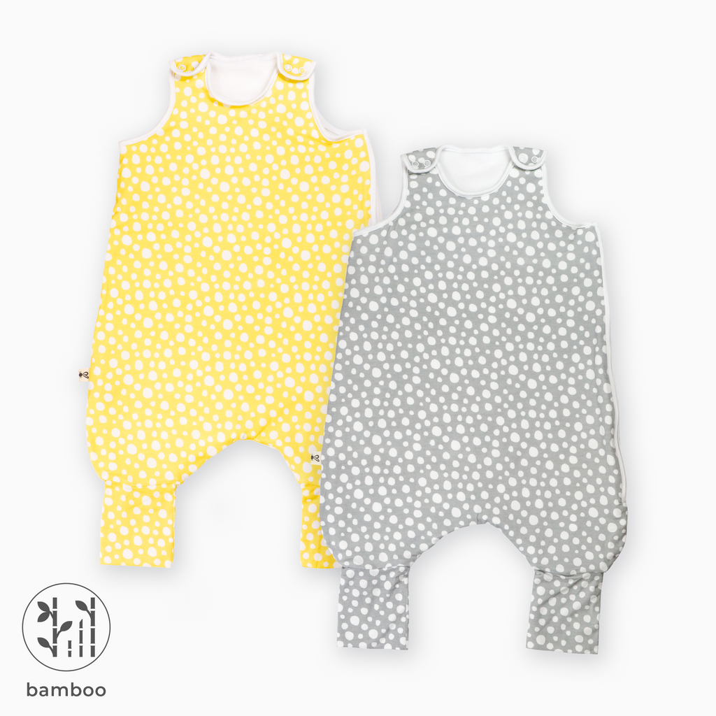 Two LiaaBébé Toddler Sleeping Bag with feet. One in light grey with dots and one in light yellow color with dots.